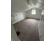 Attic space with white walls, white trim, brown carpet, and a window with natural light at 1739 Crystal St, Anderson, IN 46012