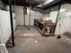 Unfinished basement with exposed ductwork, concrete walls, and potential for customization at 1739 Crystal St, Anderson, IN 46012