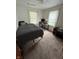 Bedroom with carpet, white walls, gray comforter, and natural light from two windows at 1739 Crystal St, Anderson, IN 46012