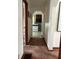 View down carpeted hallway leading to bright kitchen at 1739 Crystal St, Anderson, IN 46012