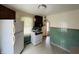 Well-lit kitchen with white appliances and a view of the arched doorway at 1739 Crystal St, Anderson, IN 46012