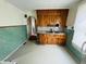 Vintage kitchen featuring ample cabinet space and retro tiling at 1739 Crystal St, Anderson, IN 46012