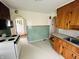 Spacious kitchen with classic wooden cabinets and vintage tile at 1739 Crystal St, Anderson, IN 46012