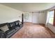 Bright living room featuring modern sliding barn door and comfortable furnishings at 1739 Crystal St, Anderson, IN 46012