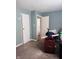 An empty bedroom features neutral paint, carpeted floor, and a closet at 1809 N Harding St, Indianapolis, IN 46202