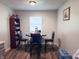 Cozy dining area featuring a round table and chairs with natural light at 1809 N Harding St, Indianapolis, IN 46202