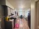 Open kitchen leading to the dining area with modern appliances and ample countertop space at 1809 N Harding St, Indianapolis, IN 46202