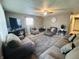 Spacious living room featuring comfortable seating, ceiling fan, and stylish decor at 1809 N Harding St, Indianapolis, IN 46202