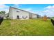 A home with a spacious backyard, patio, play set, and fencing at 1893 Glenmoor Ct, Columbus, IN 47201