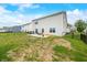 Spacious backyard features a patio, grill, play set, and tranquil pond view at 1893 Glenmoor Ct, Columbus, IN 47201