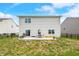 Exterior of home with patio, outdoor dining, grill, and sandbox at 1893 Glenmoor Ct, Columbus, IN 47201
