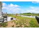 Large backyard with patio, grill, play set, and scenic pond view at 1893 Glenmoor Ct, Columbus, IN 47201
