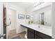 Bright bathroom featuring a long countertop, a sink, a big mirror, and neutral colored decorations at 1893 Glenmoor Ct, Columbus, IN 47201