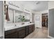 Elegant bathroom with a double vanity, large mirror, and a separate closet for optimal storage at 1893 Glenmoor Ct, Columbus, IN 47201