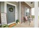 Inviting front porch with seating and decor at 1893 Glenmoor Ct, Columbus, IN 47201