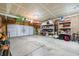 Spacious garage with ample storage, a large door, and plenty of room for parking and projects at 1893 Glenmoor Ct, Columbus, IN 47201