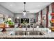 Granite countertops, stainless sink, and views into the Gathering room give an open concept to this kitchen at 1893 Glenmoor Ct, Columbus, IN 47201