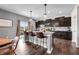 Lovely kitchen with dark cabinetry, an island with seating, and stainless steel appliances at 1893 Glenmoor Ct, Columbus, IN 47201