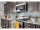 Kitchen featuring stainless steel appliances, granite counters, and subway tile backsplash at 1893 Glenmoor Ct, Columbus, IN 47201