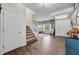 Cozy living room with staircase, hardwood floors, and view of the front yard at 1893 Glenmoor Ct, Columbus, IN 47201