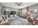 Cozy living room with plush seating, stylish decor, and a ceiling fan, perfect for relaxation and entertaining at 1893 Glenmoor Ct, Columbus, IN 47201