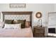 Close-up of the main bedroom features a headboard, lamps, throw pillows, and tasteful decorations at 1893 Glenmoor Ct, Columbus, IN 47201
