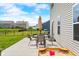 The outdoor patio offers a dining set, grill, sandbox, and firepit, ideal for outdoor gatherings at 1893 Glenmoor Ct, Columbus, IN 47201