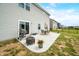 Backyard with patio, grill, dining set, and fire pit, perfect for outdoor gatherings at 1893 Glenmoor Ct, Columbus, IN 47201