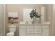 Well-lit bathroom with a dual vanity, large mirror, and stylish decor at 19445 Boulder Brook Ln, Westfield, IN 46074
