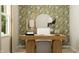 An elegant home office featuring botanical wallpaper, warm lighting, and a spacious desk at 19445 Boulder Brook Ln, Westfield, IN 46074