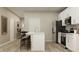 Open kitchen with stainless steel appliances, a central island, and modern fixtures at 19445 Boulder Brook Ln, Westfield, IN 46074