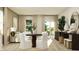 An open-concept living and dining space filled with neutral tones and natural light at 19445 Boulder Brook Ln, Westfield, IN 46074