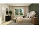 Cozy main bedroom with a neutral color palette, accent wall, and lots of natural light at 19445 Boulder Brook Ln, Westfield, IN 46074