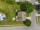An aerial view of a home showcasing the backyard, firepit, mature trees and surrounding neighborhood at 2 E Quail Wood Ln, Westfield, IN 46074