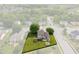 Aerial view of the home, highlighting the lot lines, backyard firepit, shed, and surrounding mature trees at 2 E Quail Wood Ln, Westfield, IN 46074
