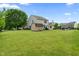A large, grassy backyard includes a wooden shed at 2 E Quail Wood Ln, Westfield, IN 46074