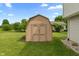 A backyard featuring a wooden shed at 2 E Quail Wood Ln, Westfield, IN 46074
