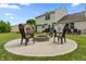 Outdoor entertainment area with a fire pit, seating, and plenty of space for gathering and enjoying the backyard at 2 E Quail Wood Ln, Westfield, IN 46074