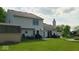 Large backyard with patio area, shed, mature trees, and a chimney at 2 E Quail Wood Ln, Westfield, IN 46074