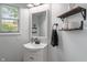 Well-lit bathroom with updated vanity and shelving at 2 E Quail Wood Ln, Westfield, IN 46074