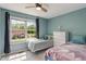 Cozy bedroom with large window and two twin beds at 2 E Quail Wood Ln, Westfield, IN 46074