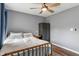 Cozy bedroom featuring a wood-frame bed, a ceiling fan, and neutral tones to give off a bright and comfortable feel at 2 E Quail Wood Ln, Westfield, IN 46074