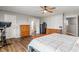 Spacious bedroom with hardwood flooring, wood furniture, and attached bathroom at 2 E Quail Wood Ln, Westfield, IN 46074