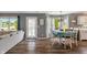 Bright dining area flows seamlessly into the living room, showcasing hardwood floors and an abundance of natural light at 2 E Quail Wood Ln, Westfield, IN 46074