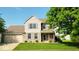 Charming two-story home with a well-manicured lawn, attached garage, and inviting front porch at 2 E Quail Wood Ln, Westfield, IN 46074