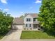 Two-story home with a large yard, attached garage, and mature trees at 2 E Quail Wood Ln, Westfield, IN 46074