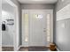 Welcoming foyer with hardwood floors and natural light, offering a glimpse into the home's spacious layout at 2 E Quail Wood Ln, Westfield, IN 46074