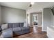 Comfortable living room with hardwood floors, neutral paint, a cozy sofa and ceiling fan at 2 E Quail Wood Ln, Westfield, IN 46074
