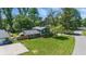 Aerial shot of a two-story house with a well-manicured lawn, showcasing its curb appeal and location at 2009 Friendship Dr, Indianapolis, IN 46217