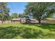 Expansive backyard featuring a gazebo and a large tree, providing ample outdoor space at 2009 Friendship Dr, Indianapolis, IN 46217